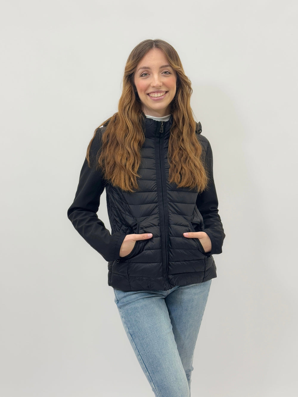 Light blue Lara™ ultra-lightweight puffer jacket by Emma & Rose Cape Town, detailed view of the jacket's stitching and material.