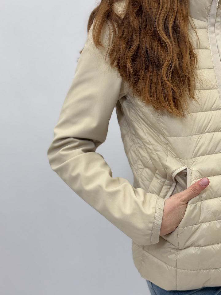 Light blue Lara™ ultra-lightweight puffer jacket by Emma & Rose Cape Town, close-up showing quilted design and detailed stitching.