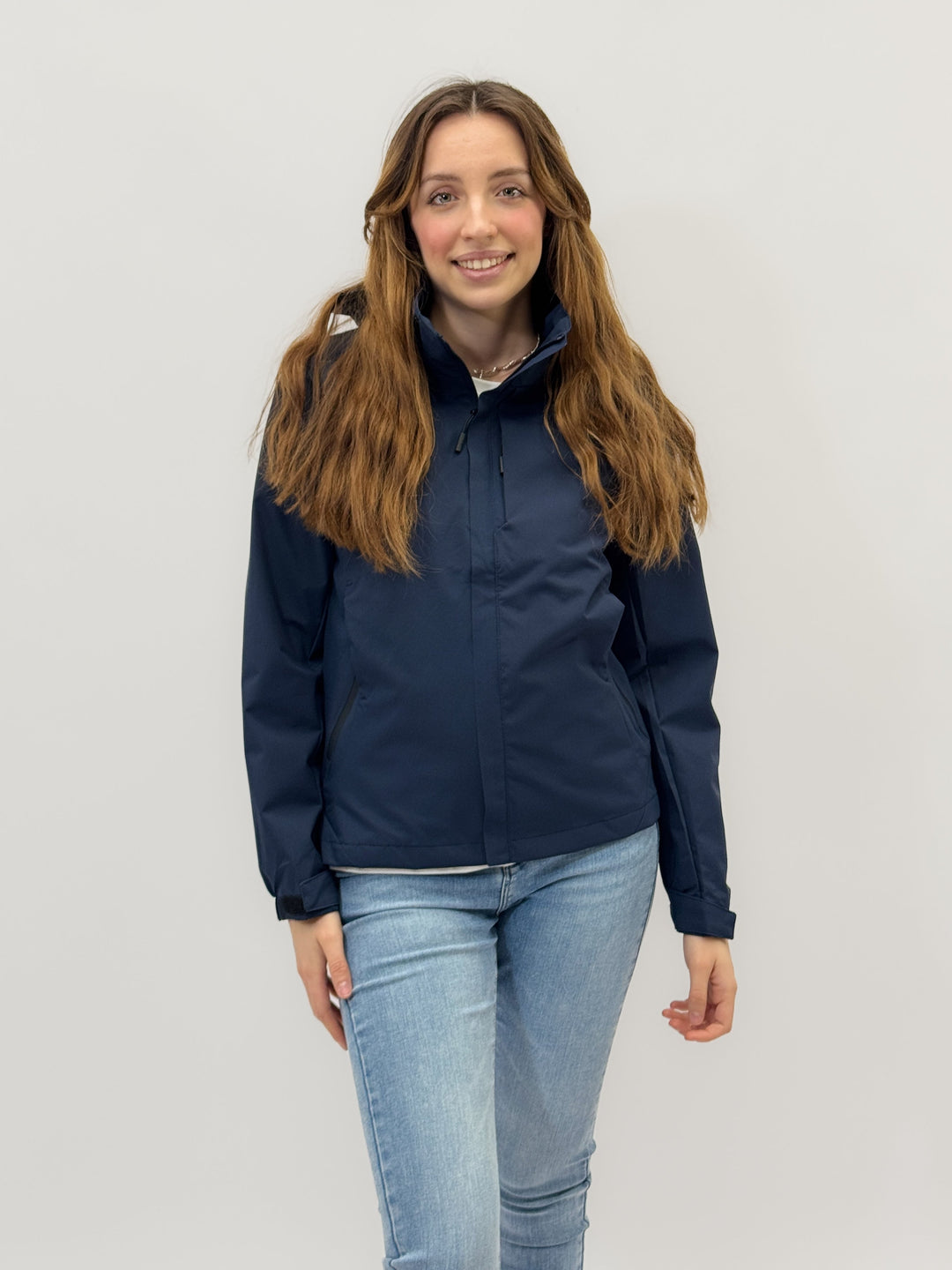 Light blue Nadia™ Premium Windbreaker jacket by Emma & Rose Cape Town, shown on a hanger with a sleek, stylish design.