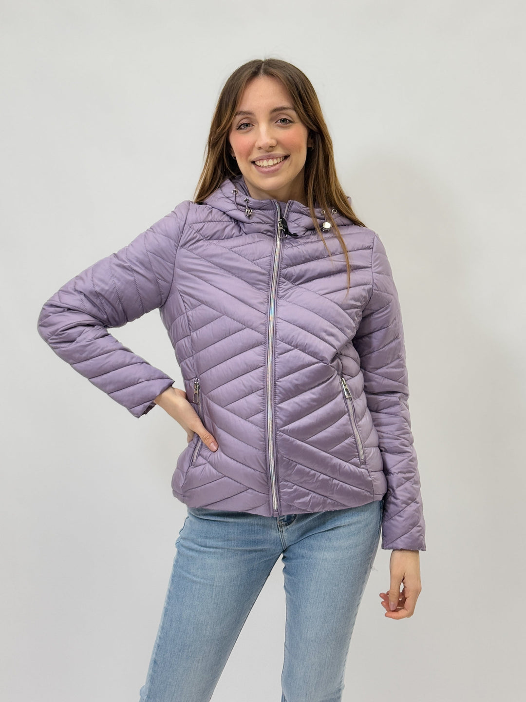 Lilac Karina™ hooded puffer jacket by Emma & Rose Cape Town, featuring a cozy, quilted design with a front zipper and hood.