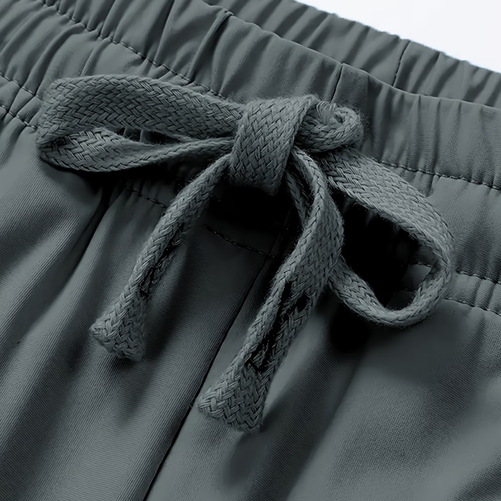 Close-up of Outdoor™ Quickdry Stretch Pants Pro by Emma & Rose Cape Town, showing breathable, flexible fabric and sleek design.