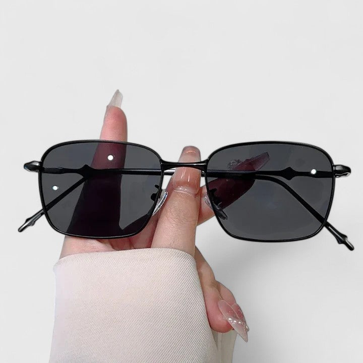 Emma & Rose Cape Town Raygynn™ stylish sunglasses with black and gold frames, showcasing a modern, fashionable design.