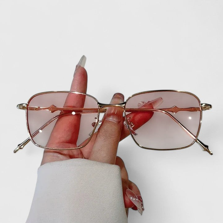 Emma & Rose Cape Town Raygynn stylish sunglasses with gold and black frames, featuring a sleek, modern design.