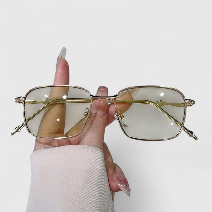 Emma & Rose Cape Town Raygynn™ stylish sunglasses with golden and black frame, showcasing a modern, trendy design.