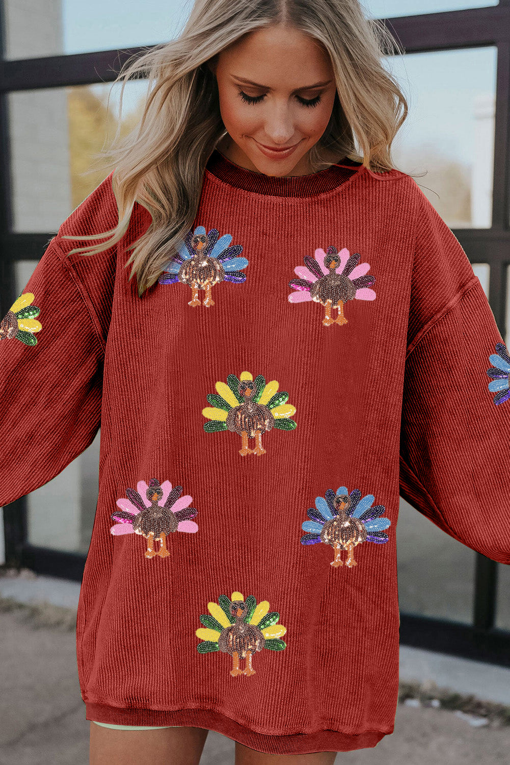 Racing red turkey graphic sequins patch corded baggy sweatshirt by Emma & Rose Cape Town, featuring bold turkey design and casual fit.