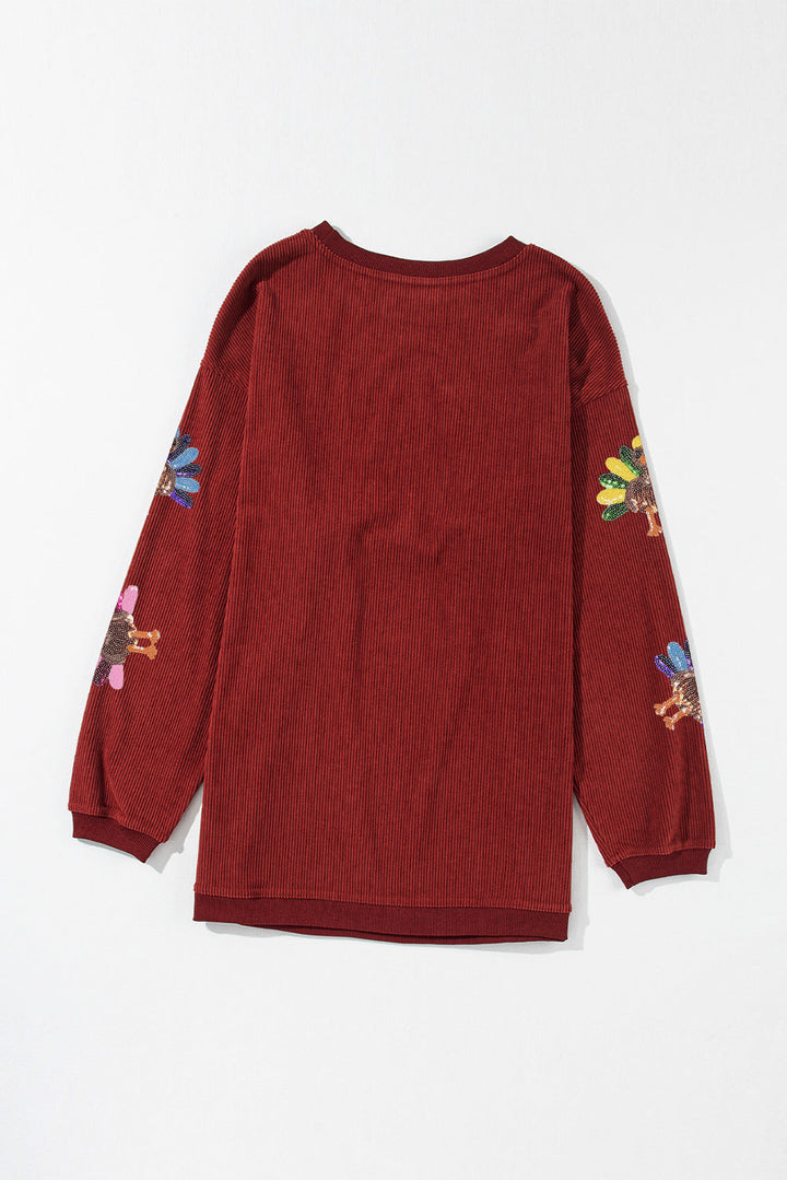 Racing Red Turkey graphic sequins patch corded baggy sweatshirt by Emma & Rose Cape Town, with colorful turkey design and relaxed fit.