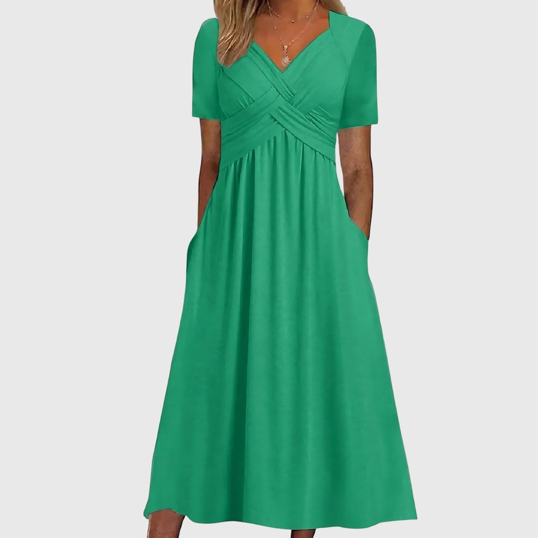 Green Viola™ midi dress by Emma & Rose Cape Town with tummy control, featuring a stylish, fitted silhouette and elegant design.