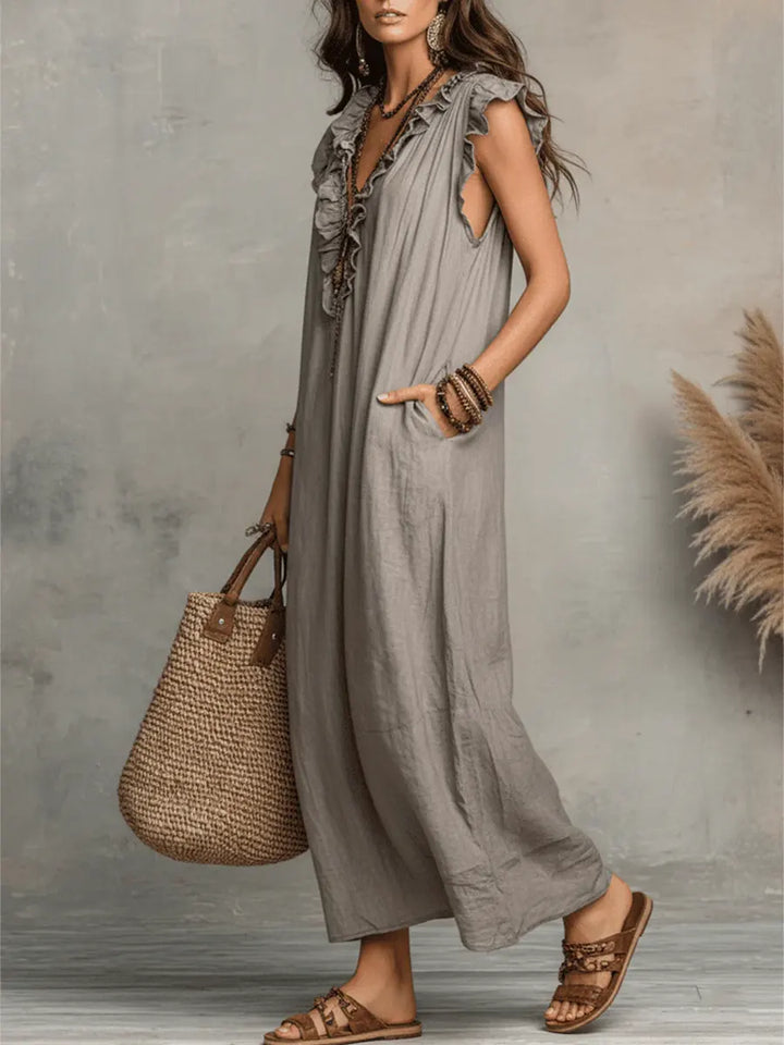 Camelia™ long Bohemian dress by Emma & Rose Cape Town featuring flowy fabric and intricate embroidery on a model.