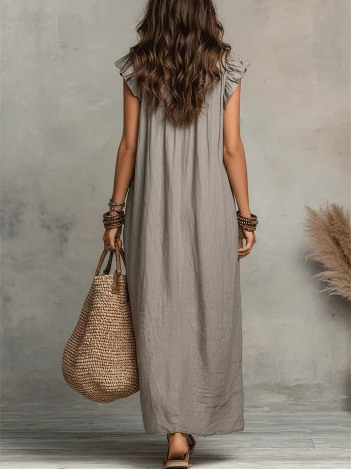 Camelia™ long bohemian dress by Emma & Rose Cape Town featuring flowing fabric and intricate embroidery.