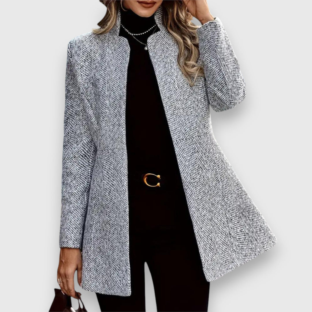Gray Mizari™ tailored statement blazer by Emma & Rose Cape Town, shown on a hanger with detailed fabric texture.