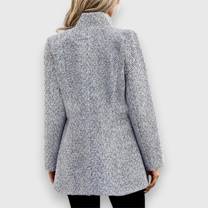 Emma & Rose Cape Town Mizari tailored grey statement blazer with structured fit and classic lapels, displayed on a hanger.