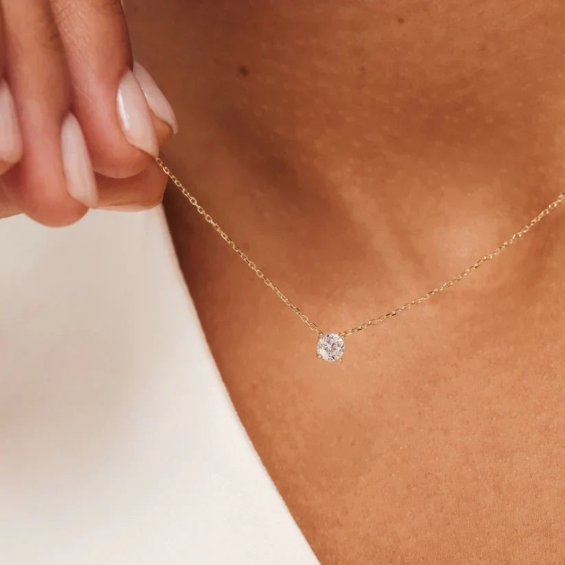 Gold Ysavienna™ Moissanite Stone Necklace from Emma & Rose Cape Town, elegant jewelry with sparkling gemstone pendant.