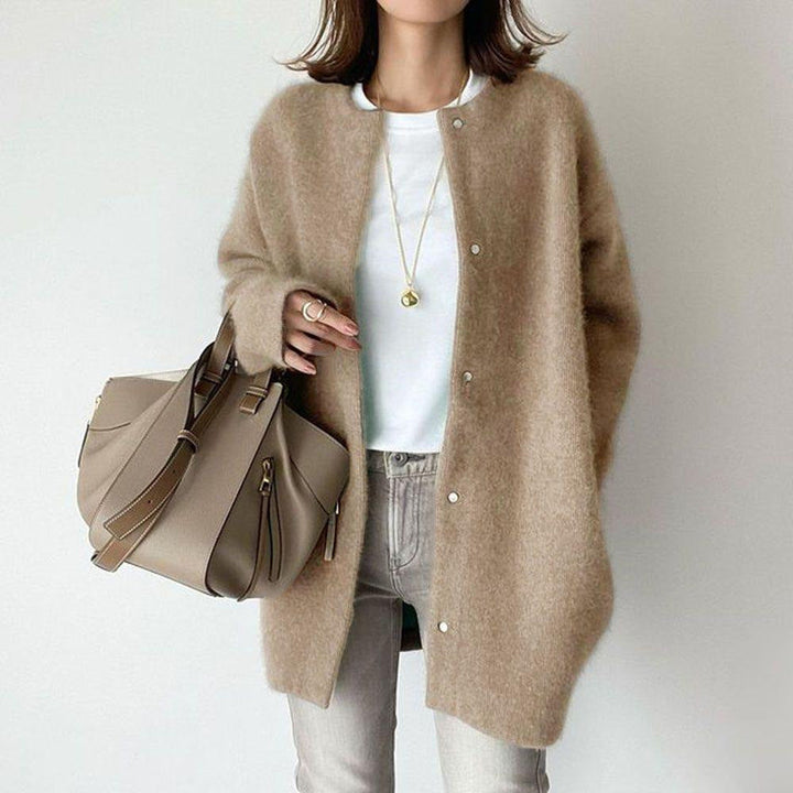 Emma & Rose Cape Town Orla™ relaxed fit khaki coat displayed on a hanger with a simple background.