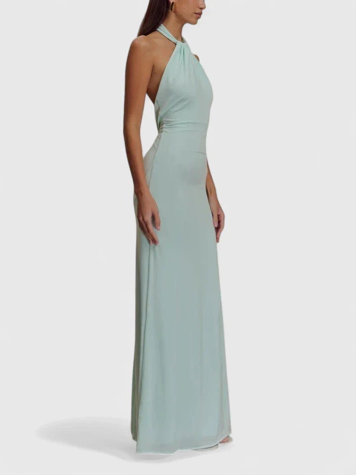 Emma & Rose Cape Town Anzhelia™ sophisticated maxi dress in lagoon color, flowing fabric and elegant design, worn by a model.