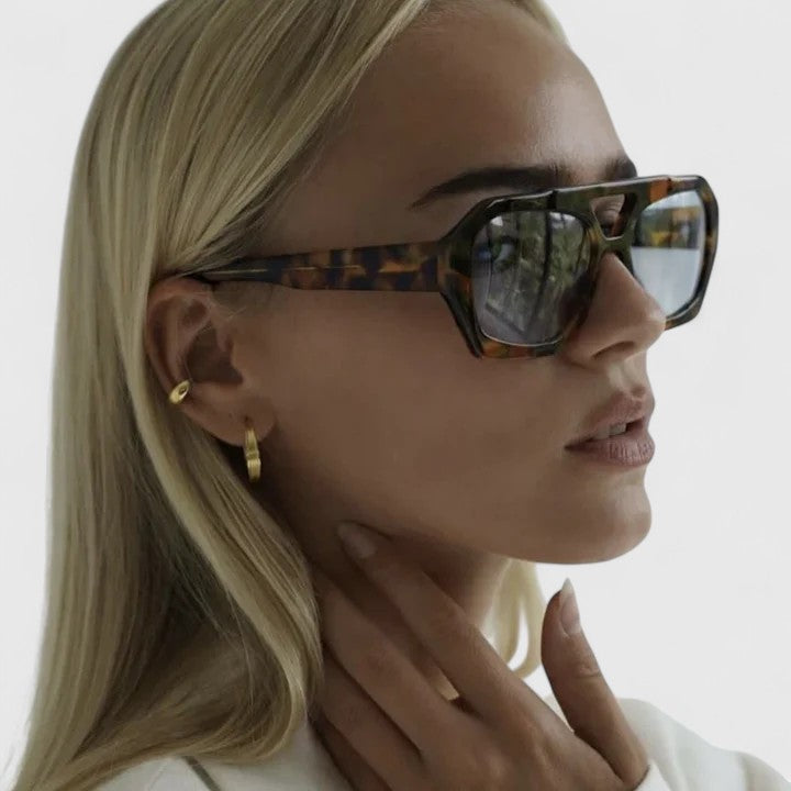 Emma & Rose Cape Town Zhaylinn™ elegant sunglasses with leopard print and champagne-colored frames, stylish and sophisticated.