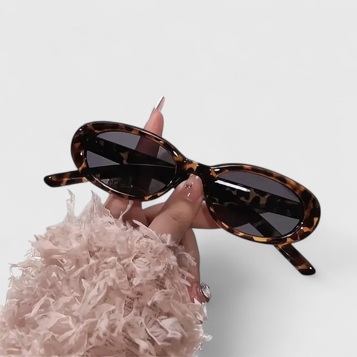 Emma & Rose Cape Town Danyqee™ stylish leopard-print grey sunglasses with rounded frames and tinted lenses.