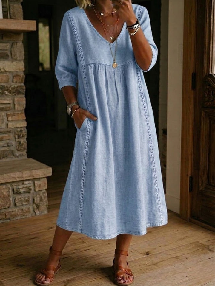 Light blue Fleur™ artistic floral sleeve dress by Emma & Rose Cape Town, featuring elegant floral patterns and stylish long sleeves.