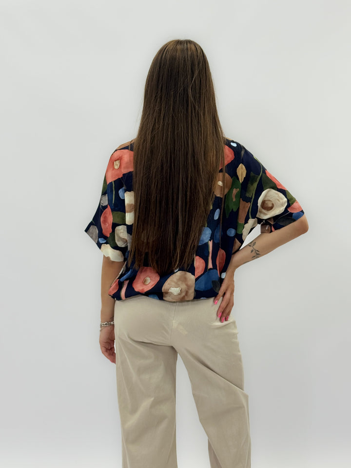 Beige Dominique™ knit top with pattern knot from Emma & Rose Cape Town, showcasing the stylish front design.