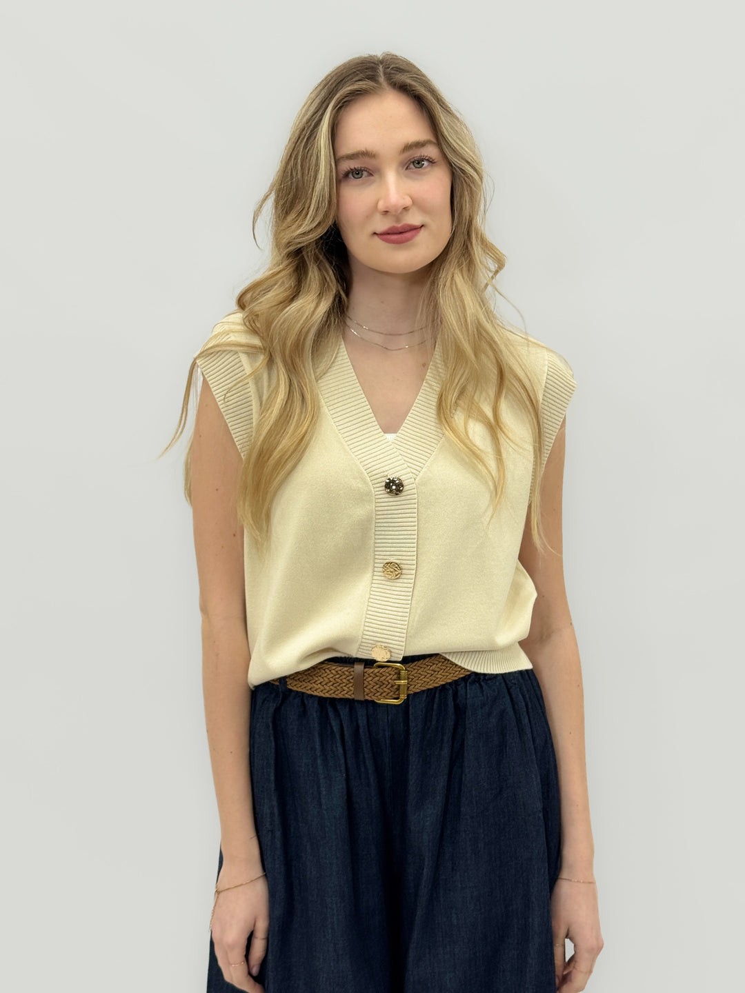 Beige women's knitted gilet with jewel buttons from Emma & Rose Cape Town, showcasing a cozy, stylish maglieria layering piece.