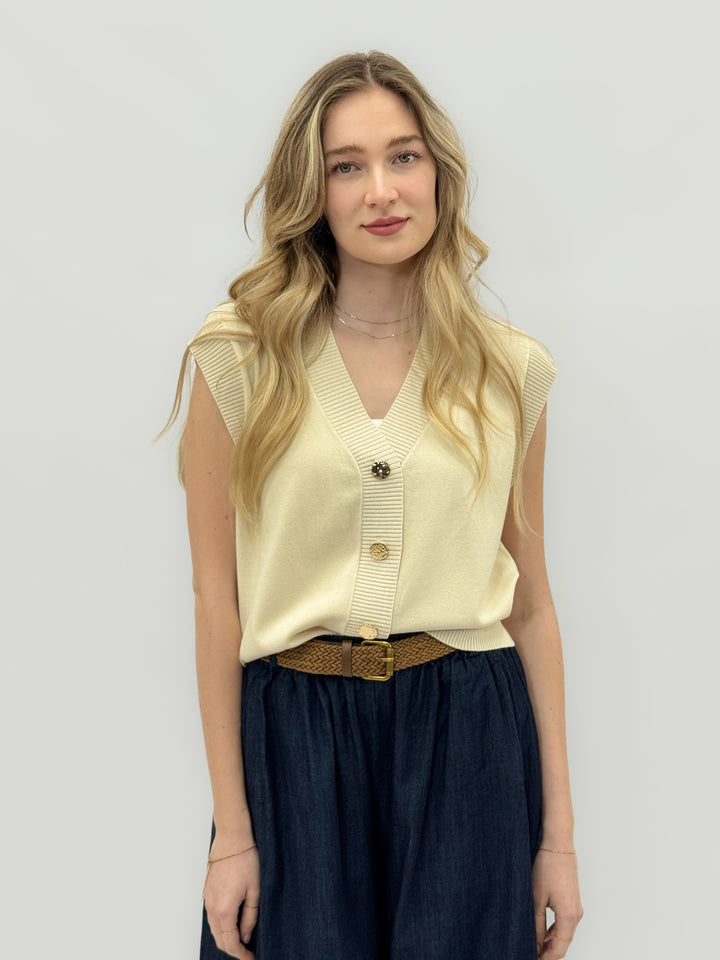 Beige women's knitted gilet with jewel buttons from Emma & Rose Cape Town, showcasing a cozy, stylish maglieria layering piece.