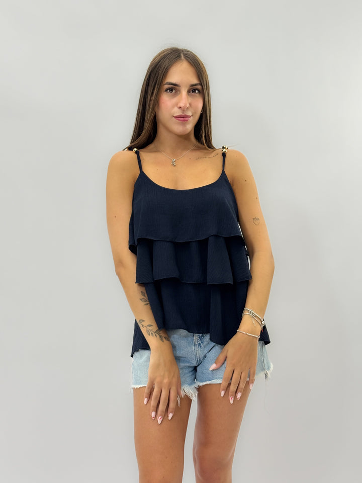 Black Suné™ top with ruffled maglieria design by Emma & Rose Cape Town, featuring a stylish and comfortable fit.