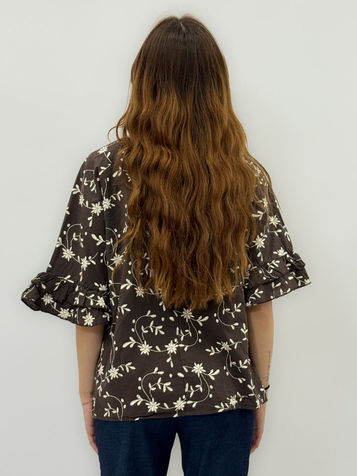 Emma & Rose Cape Town Mariska floral blouse with ruffled sleeves, in brown, featuring a stylish and feminine design.