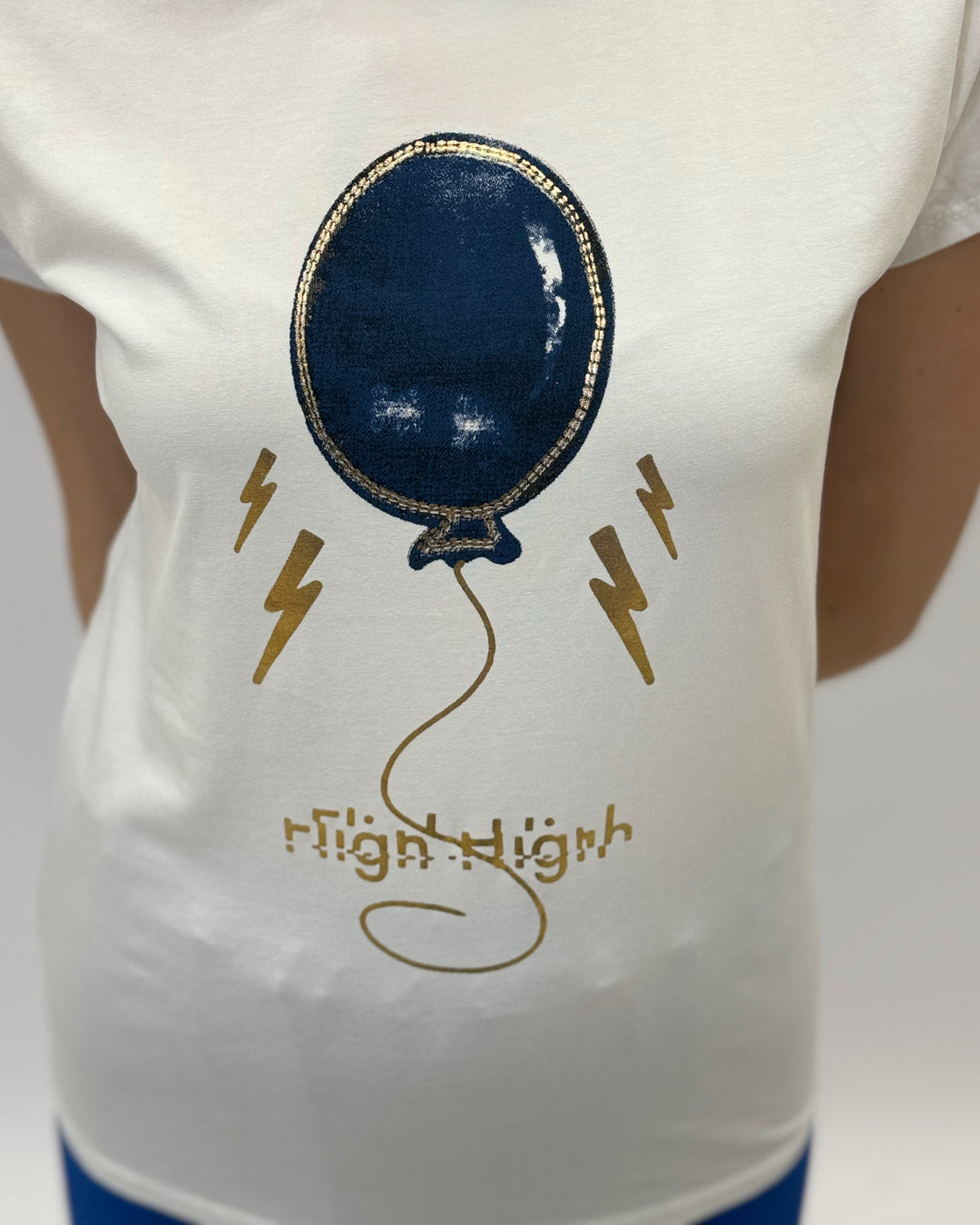 Green Amber™ T-shirt by Emma & Rose Cape Town featuring balloon text design, casual maglieria style, front view.