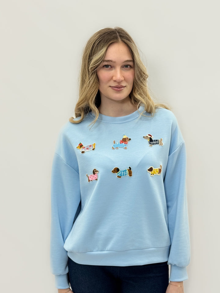 Pink Gretchen Dachshund patch sweatshirt from Emma & Rose Cape Town, featuring a cozy knit neck and charming dachshund design.
