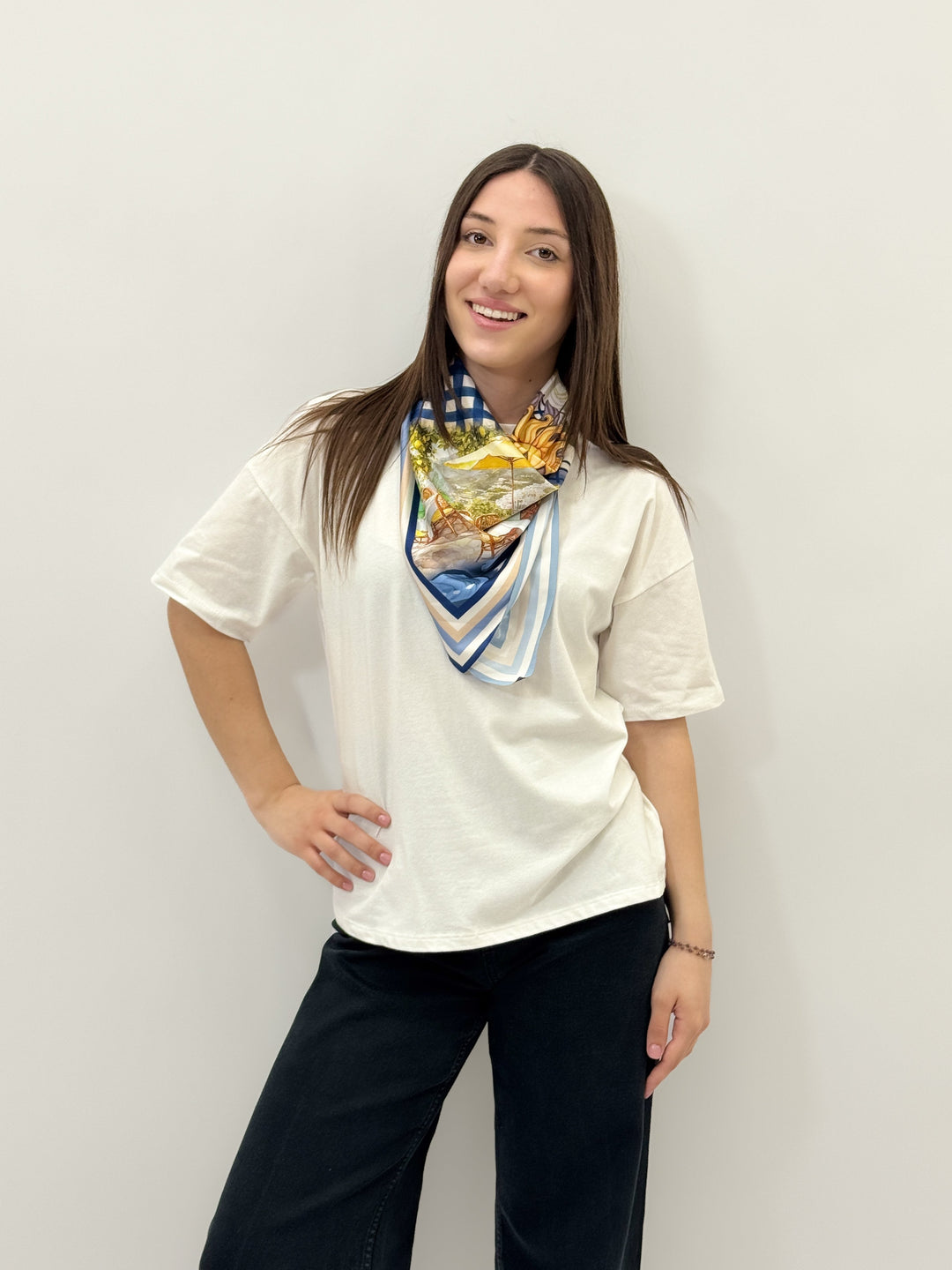 Red Adele™ T-shirt scarf from Emma & Rose Cape Town, made of soft, luxurious fabrics, styled as a cozy, versatile accessory.