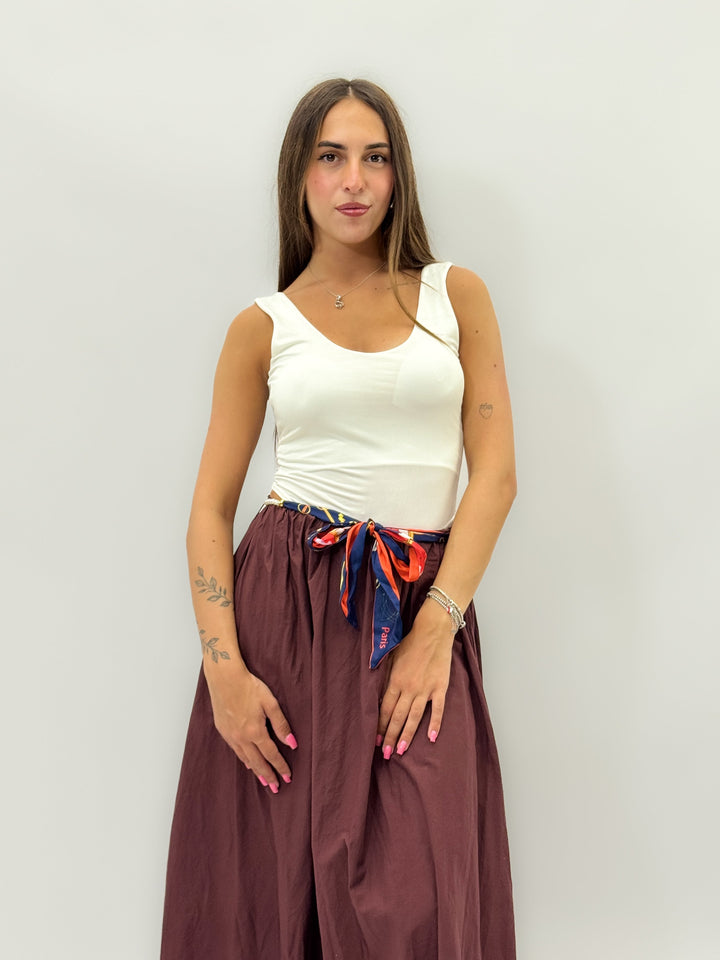 White Veronique™ sleeveless bodysuit by Emma & Rose Cape Town, featuring smooth fabric and a fitted design.