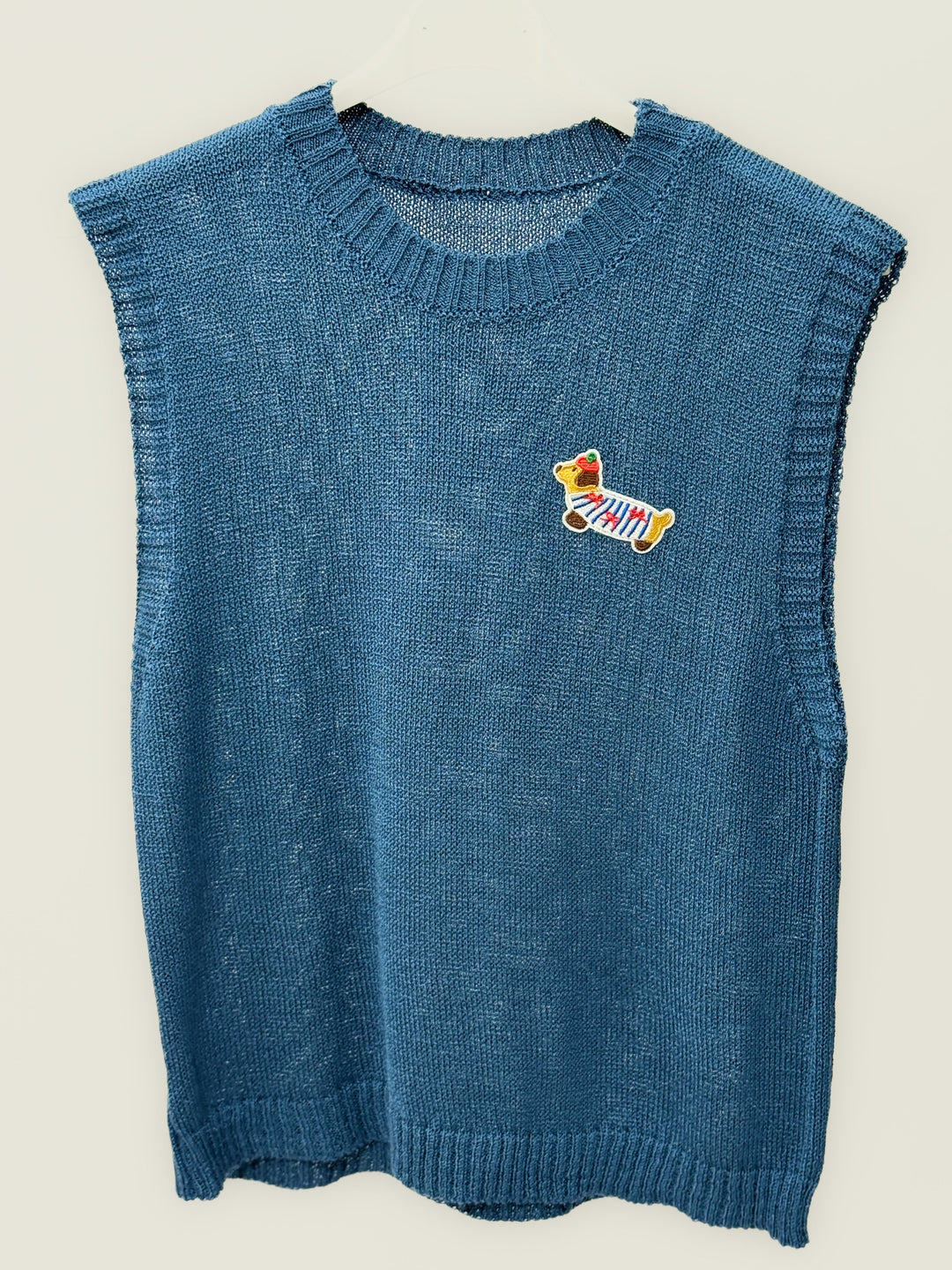 Yellow Gabriëlle™ lightweight knitted gilet by Emma & Rose Cape Town, featuring a chic, cozy knitted maglieria design.
