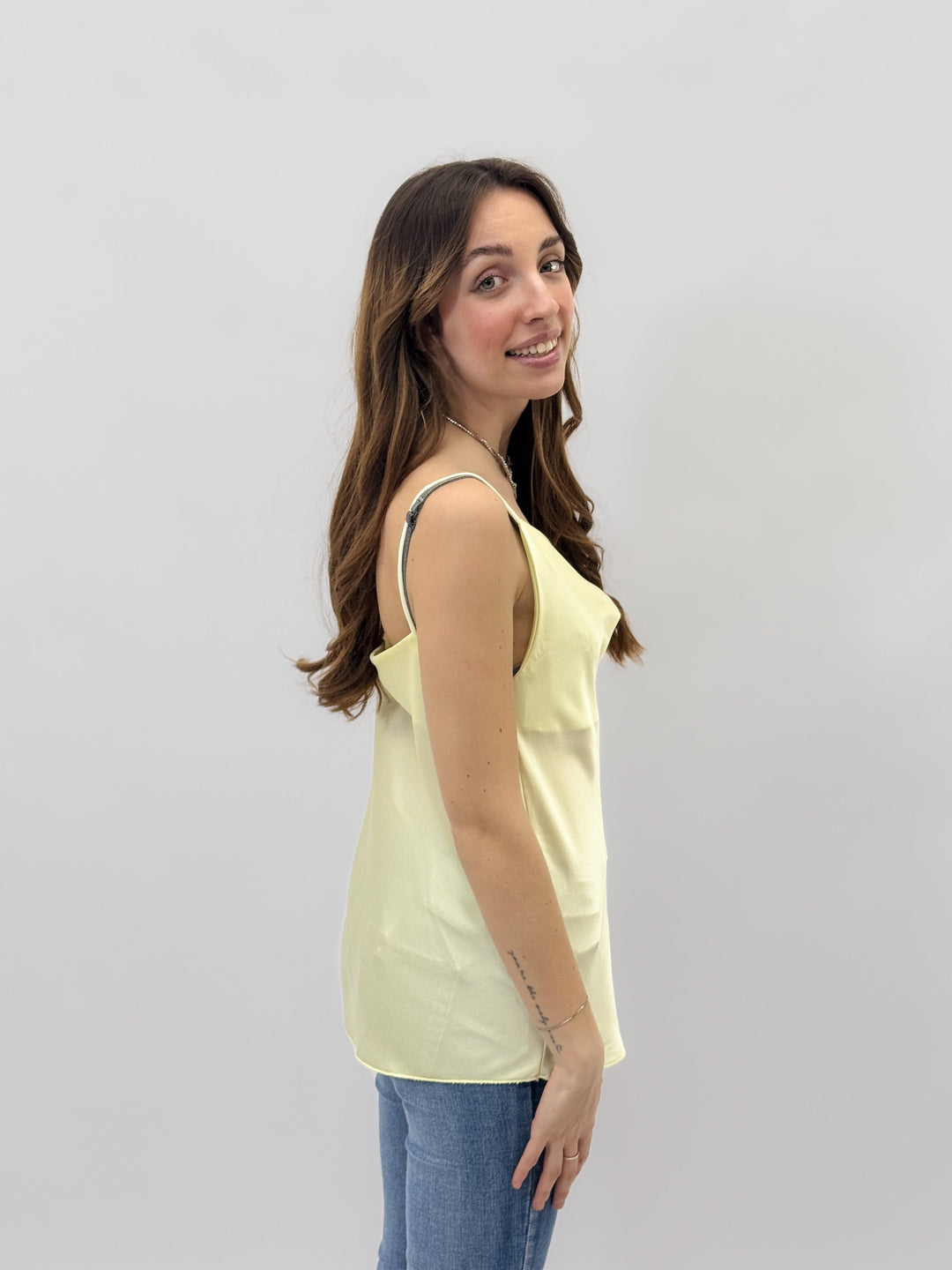 Yellow Hester™ maglieria top with a stylish neckline by Emma & Rose Cape Town, shown on a model.