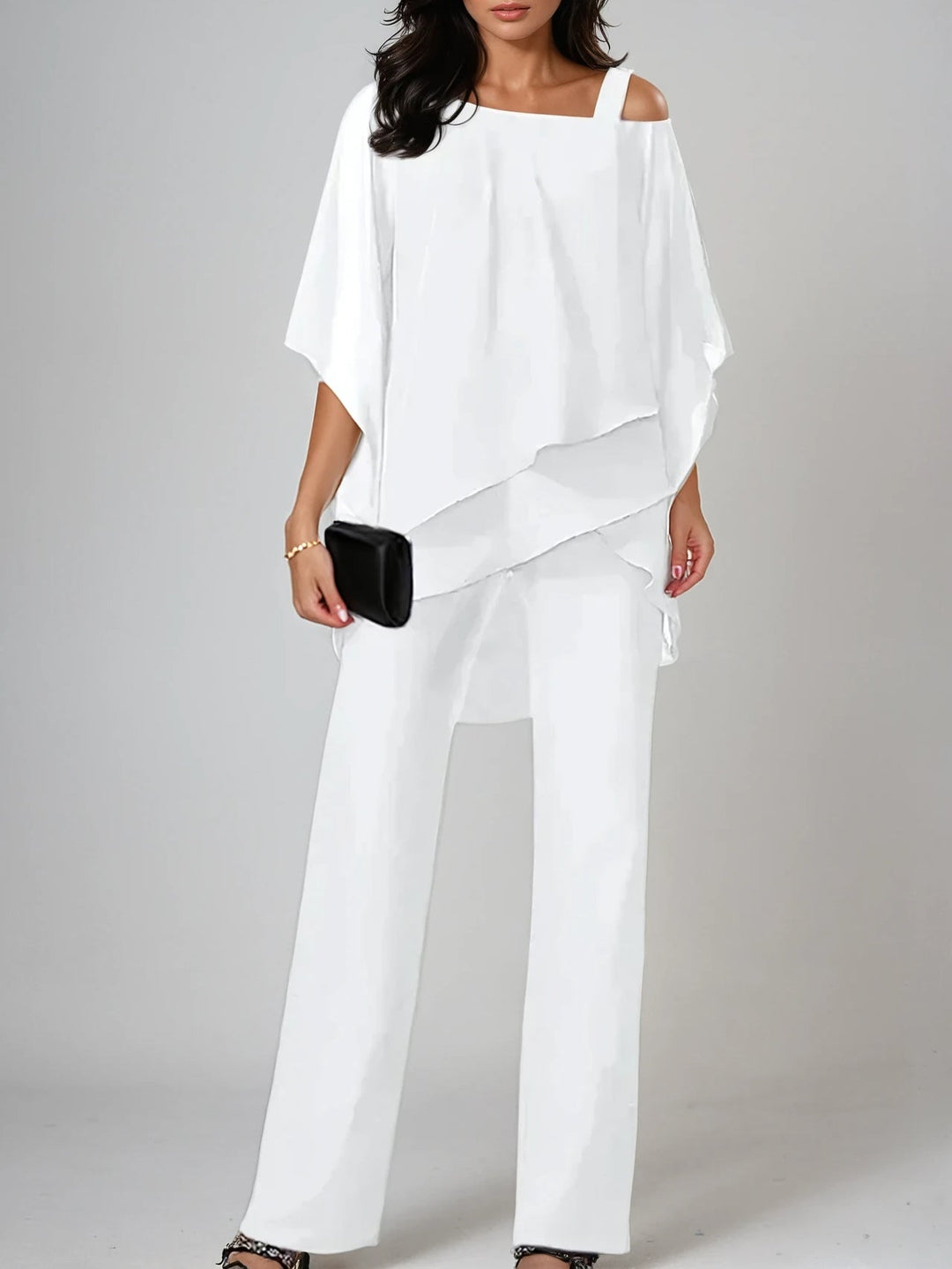 White Maren off-the-shoulder irregular flowing suit by Emma & Rose Cape Town, featuring a stylish matching set design.