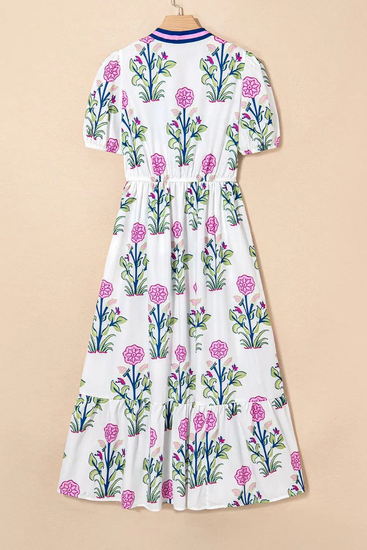 White floral midi dress with ruffle hem and pop of color neckline by Emma & Rose Cape Town, displayed on a hanger.