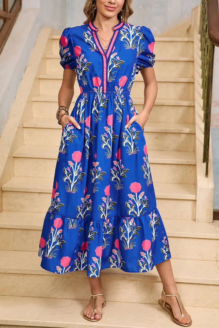 White floral midi dress with ruffle hem and colorful neckline by Emma & Rose Cape Town, perfect for spring or summer wear.