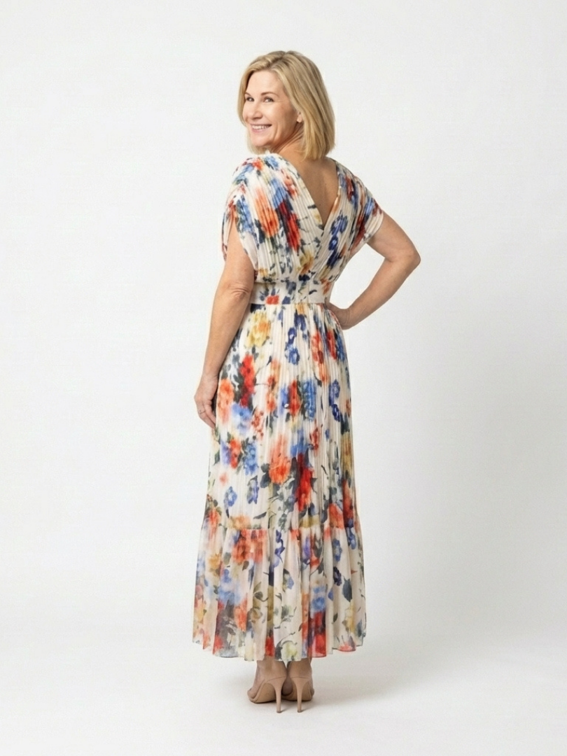 Emma & Rose Cape Town Savannah pleated floral midi dress with multicolor pattern, flowing fabric, and elegant design.