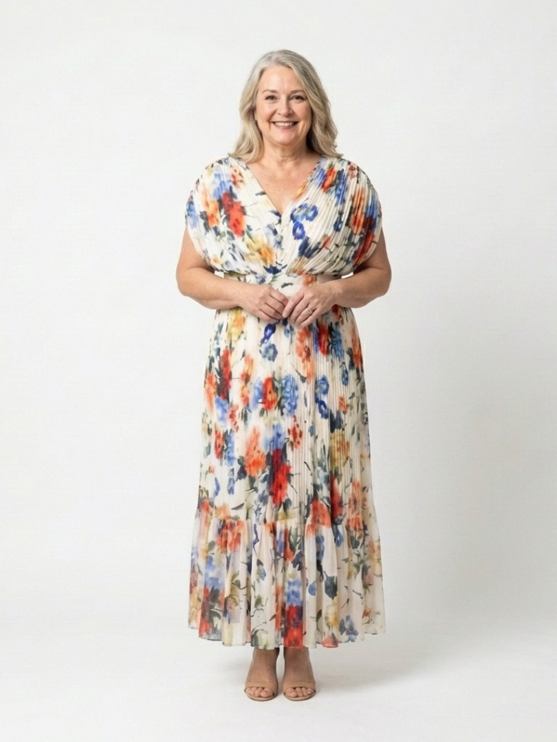 Multicolor Savannah™ pleated floral midi dress by Emma & Rose Cape Town, featuring a flowing design and vibrant pattern.