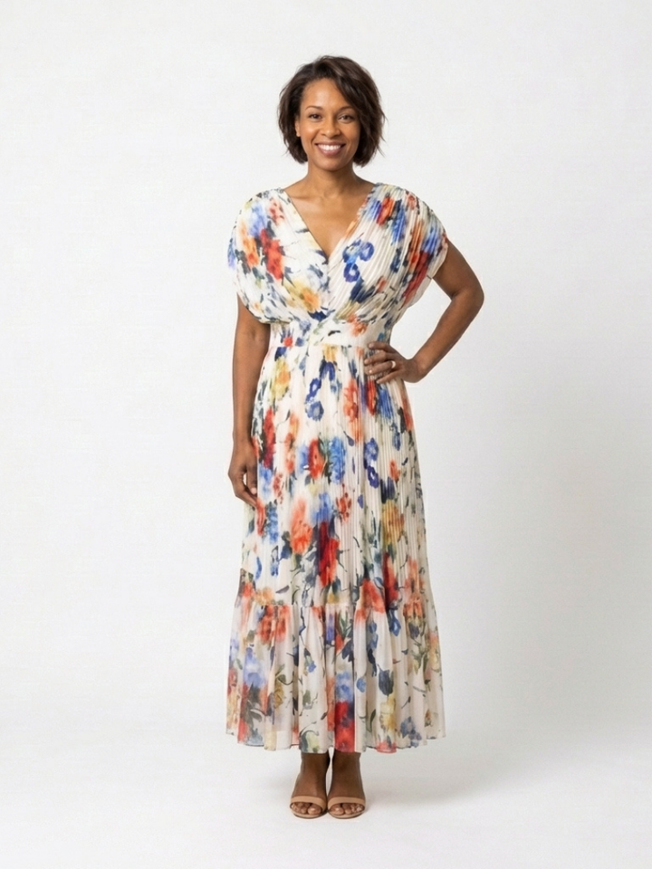Multicolor pleated floral midi dress from Emma & Rose Cape Town's Savannah™ collection, featuring a flowing design and vibrant print.
