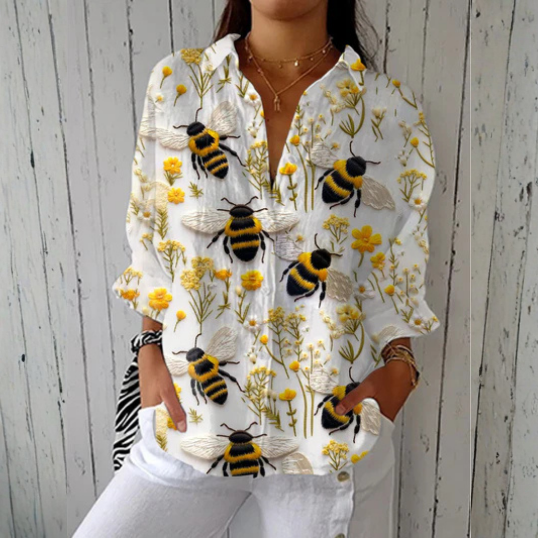 Michelle™ Golden Bee Blouse by Emma & Rose Cape Town featuring multicolor fabric and classic fit on a mannequin.