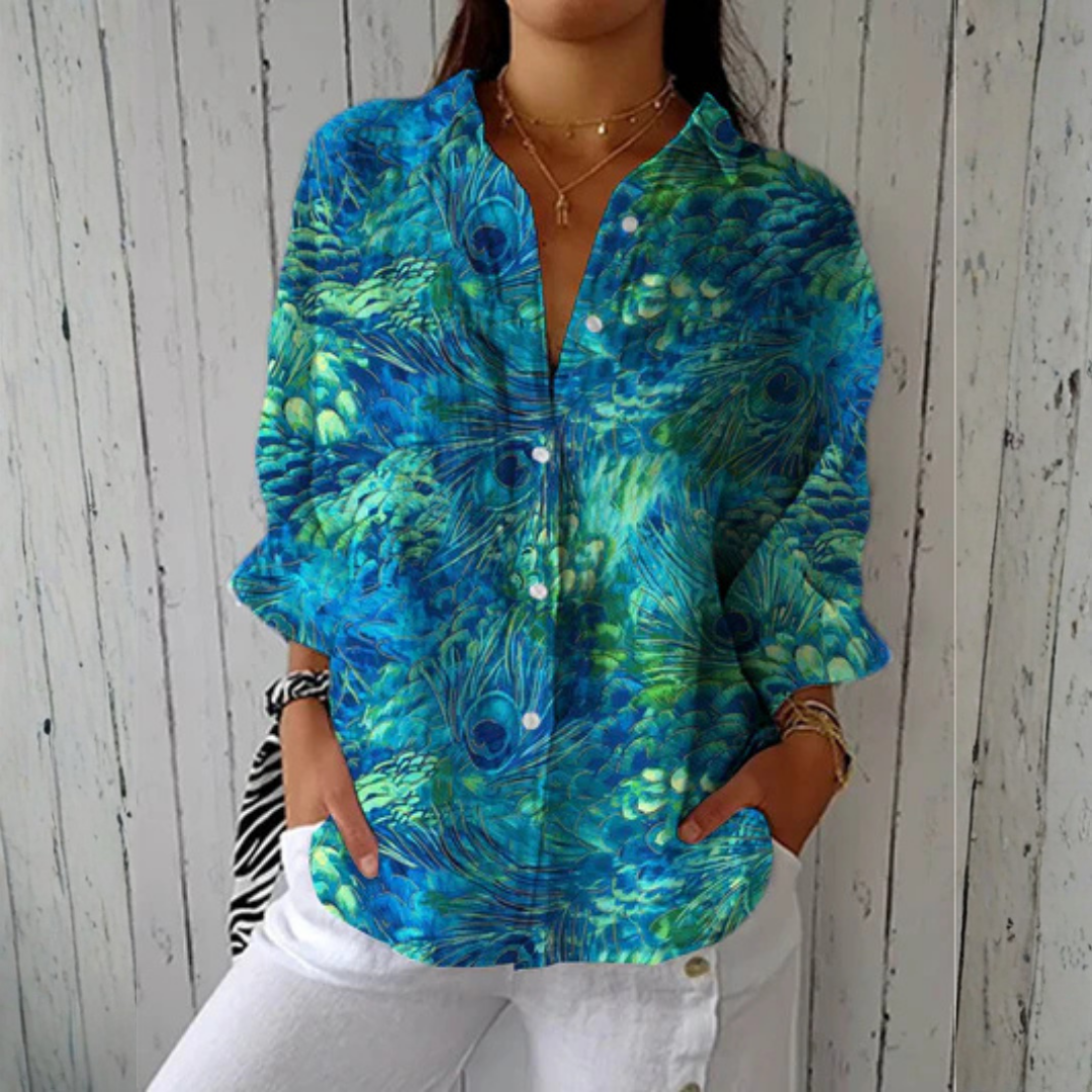 Victoria™ Peacock Grace Blouse by Emma & Rose Cape Town, multicolor fabric with elegant peacock design and flowy style.