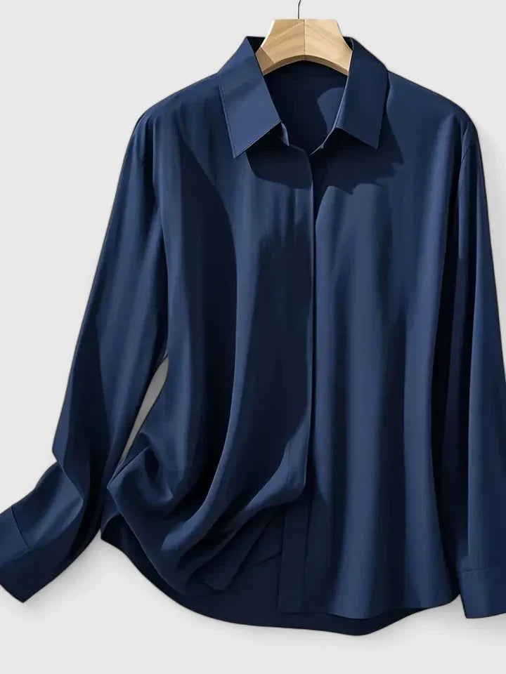 Navy blue Melvaya™ elegant top by Emma & Rose Cape Town, shown in size XS with a stylish, fitted design and soft fabric.