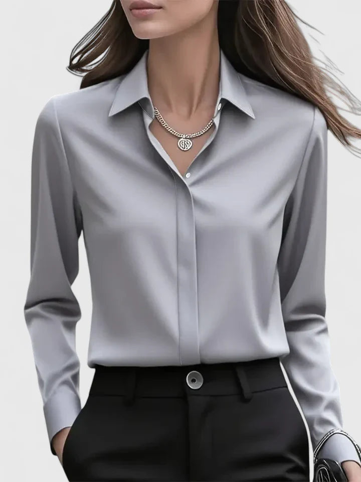 Navy blue Melvaya™ elegant top by Emma & Rose Cape Town, showing a fitted long-sleeve design with a round neckline.
