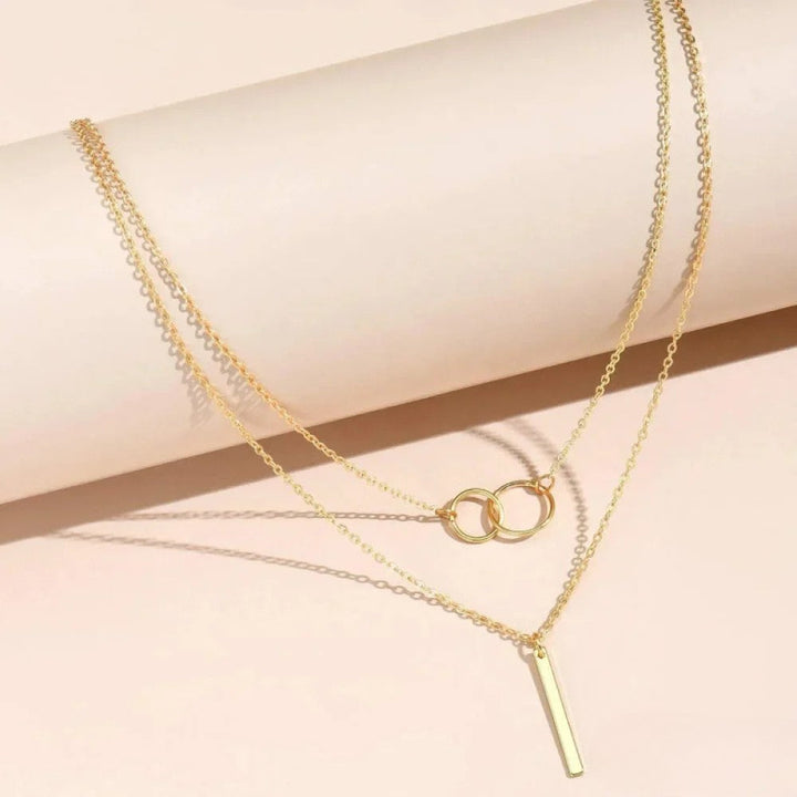 Retro™ double circle pendant necklace by Emma & Rose Cape Town featuring two interlocking circular charms on a chain.