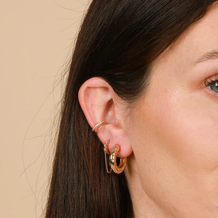Emma & Rose Cape Town Florenzia™ star earrings in 18k gold, featuring delicate star-shaped design on classic hoop earrings.