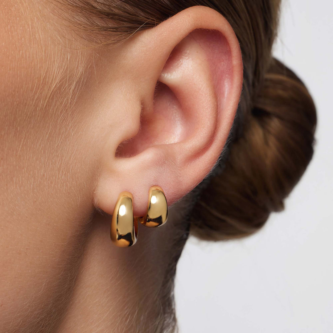 Rhaquellee™ 14k gold earrings by Emma & Rose Cape Town, elegant hoop earrings with a polished finish.