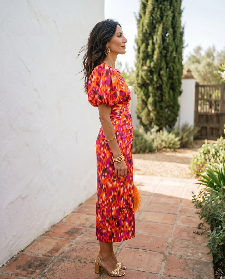 Emma & Rose Cape Town Carla printed midi dress with puff sleeves, vibrant orange fabric, stylish and feminine design.