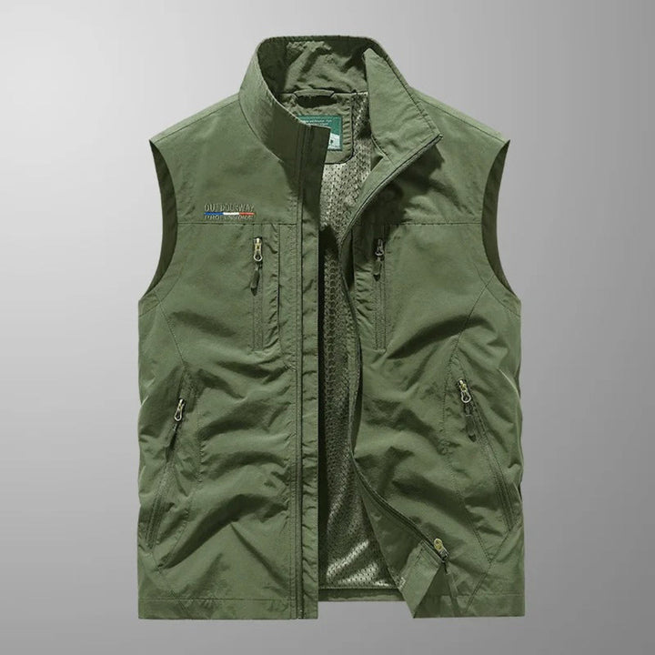 Orange men's multi-pocket outdoor gilet by Chantelle™ from Emma & Rose Cape Town, featuring multiple functional pockets and lightweight fabric.