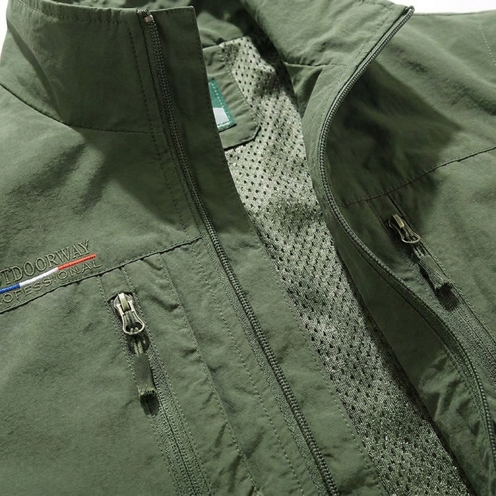 Orange men's multi-pocket outdoor gilet by Chantelle™ from Emma & Rose Cape Town, featuring multiple pockets and lightweight design.
