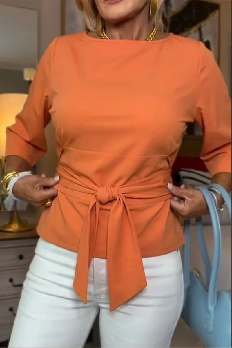 Orange Dara™ tie waist flattering top by Emma & Rose Cape Town, shown on a model with stylish fit and elegant design.