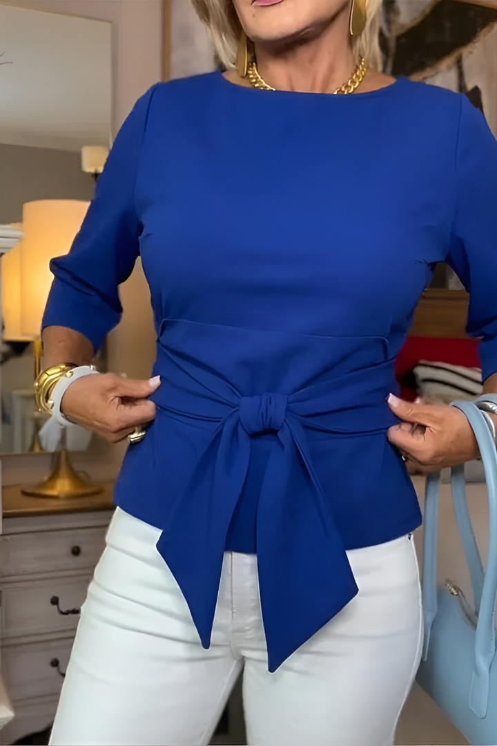 Orange Dara™ tie waist flattering top by Emma & Rose Cape Town, shown on a model with stylish sleeves and a fitted silhouette.